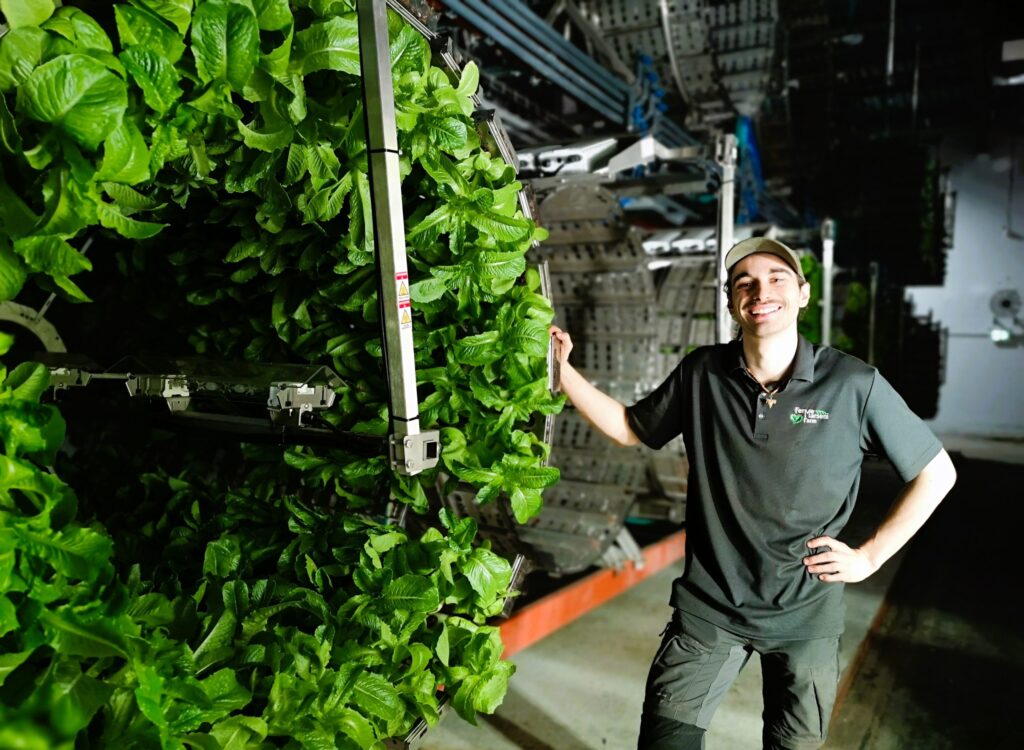 Maxine Gagnier shows off Marseni Farm's rotating lettuce growing apparatus at their "vertical" farm in Casselman.