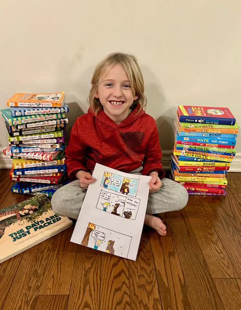 Bobby is surrounded by collections of his favourite books: Diary of a Wimpy Kid, Big Nate, and Calvin and Hobbes.
