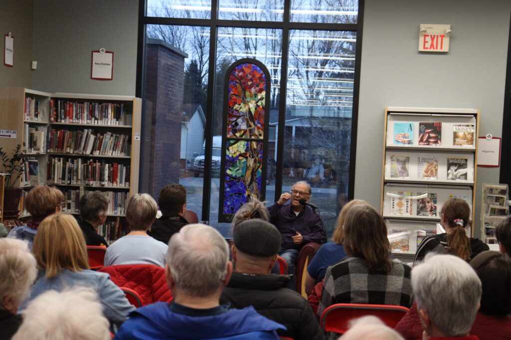 Crime author Rick Mofina speaks to a full house at the Russell Branch Library on April 14, sharing stories from his journalism career and offering a preview of his upcoming thriller, If Two Are Dead.