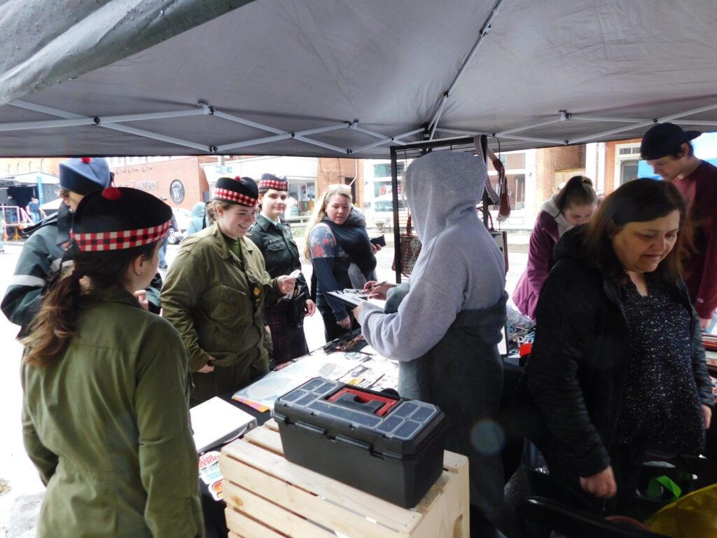 Although there were squalls of rain on Sunday, vendors continued to do business along Vankleek's main street Hill during the annual May Festival.