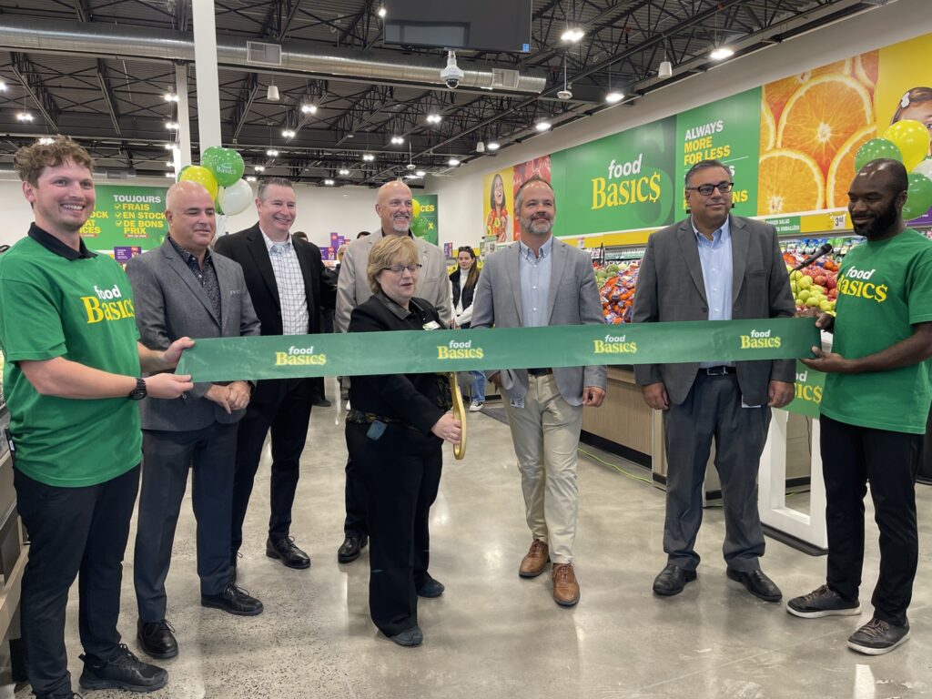 Community leaders and store representatives take part in the ribbon-cutting ceremony marking the official opening of Food Basics in Embrun, operated by Metro Ontario Inc.