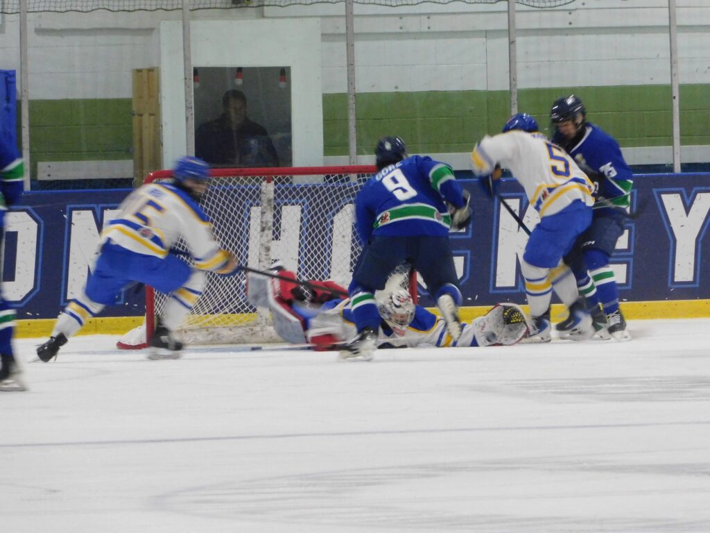 Liam Gore (9) of the Hawkesbury Hawks gets in the middle of the melée at the Canadians’ net during last Friday’s game between Hawkesbury and Carleton Place.