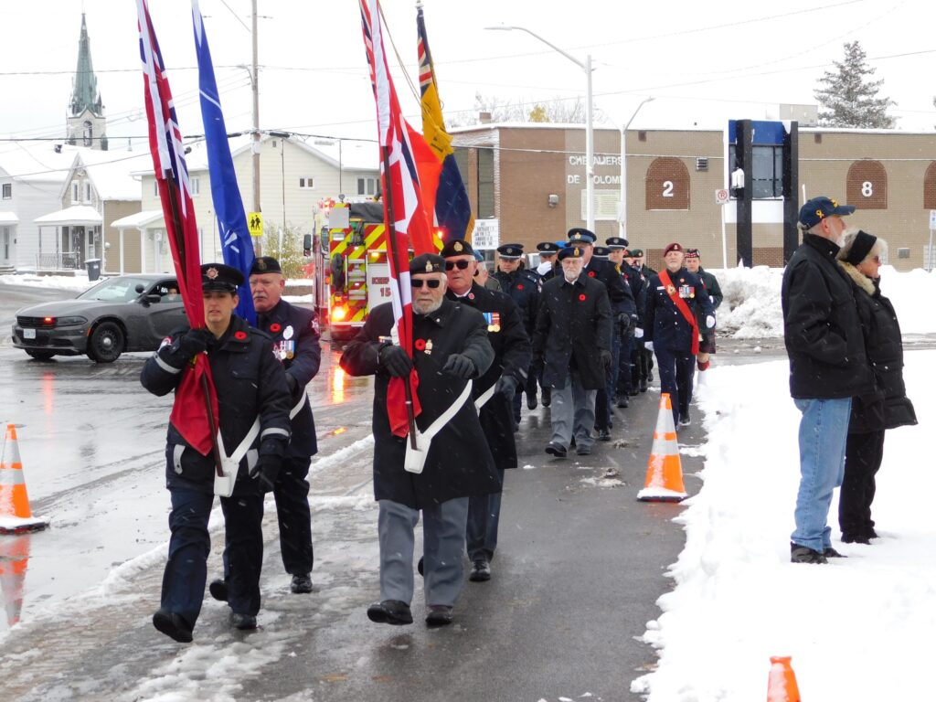Members of the Hawkesbury Royal Canadian Legion Branch, the 57 SDG Islanders Army Cadet Corp, police and other emergency service personnel march towards the Cenotaph on a blustery November 11 morning for Remembrance Day.