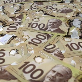 20311561 - close up view of new 100 canadian dollar banknotes.