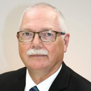 Le conseiller Charles Armstrong entend toujours tenir les promesses qu'il a faites lors de sa campagne électorale, mais des défis plus importants ont pris le dessus, comme un nouveau plan de traitement des eaux et « l'urbanisation qui s'impose aux zones agricoles de la commune ».