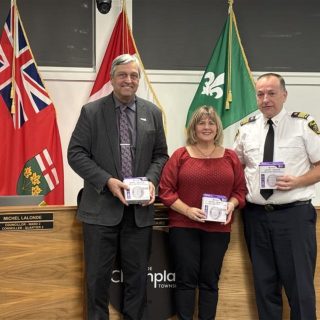 Promoting home safety through Project Zero and more awareness of the value of smoke and carbon monoxide alarms during a presentation at Champlain Township council are (left) Mayor Normand Riopel, Anik Benoit of Enbridge Gas, and Ghislain Pigeon, director of fire services for the township.