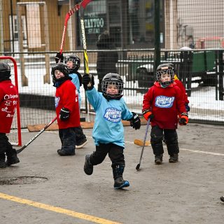 Young participants take to the street for a friendly game of 4-on-4 hockey, one of several family-friendly activities offered during the Casselman Christmas Festival.