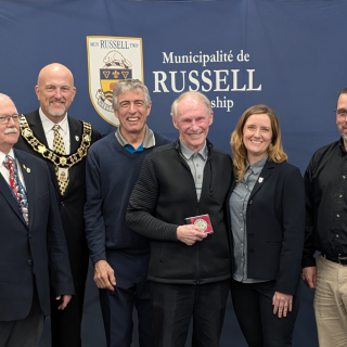 Russell Township honors Dave Dyer with a Citizen Recognition Award for his decades of dedication to local sports, volunteerism, and community-building initiatives.