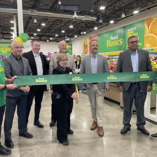 Community leaders and store representatives take part in the ribbon-cutting ceremony marking the official opening of Food Basics in Embrun, operated by Metro Ontario Inc.