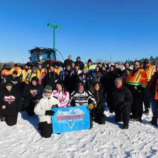ASD United volunteers, participating snowmobilers and wellwishers gather for a group photo before the start of the Seventh Annual Ride for Autism snowmobile event February 8 in Plantagenet.
