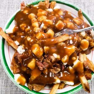 The exact recipe for the farmer's poutine at Mom's Kitchen is a closely held secret, but bits of breakfast sausage, roasted pork and beef were all present.
