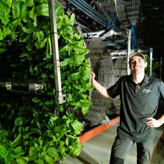 Maxine Gagnier shows off Marseni Farm's rotating lettuce growing apparatus at their "vertical" farm in Casselman.