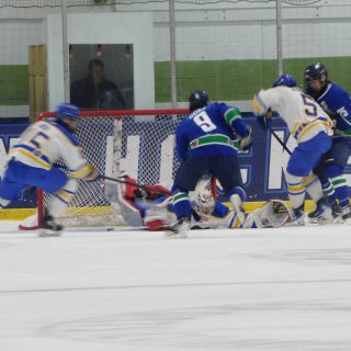 Liam Gore (9) of the Hawkesbury Hawks gets in the middle of the melée at the Canadians’ net during last Friday’s game between Hawkesbury and Carleton Place.