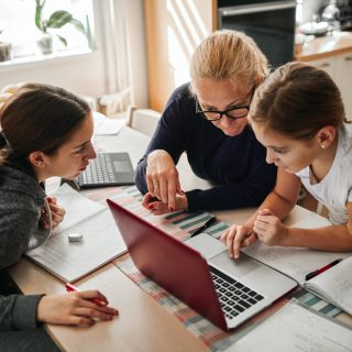 Homeschooling - Mother Helping To Her Daughters To Finish School Homework During Coronavirus Quarantine