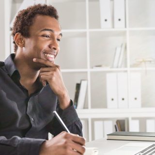 Happy man working on project